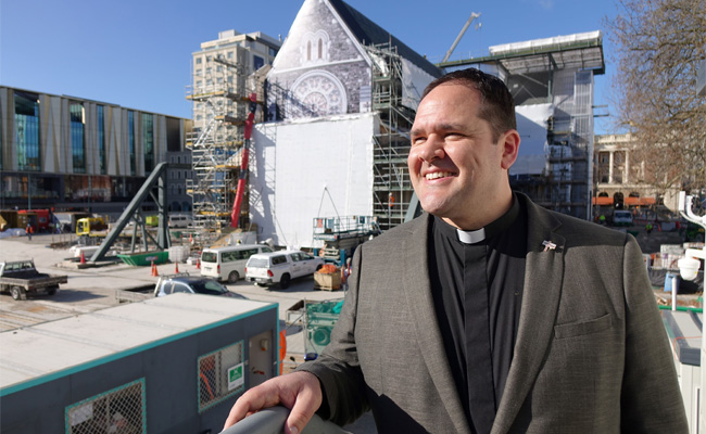 man in front of church 