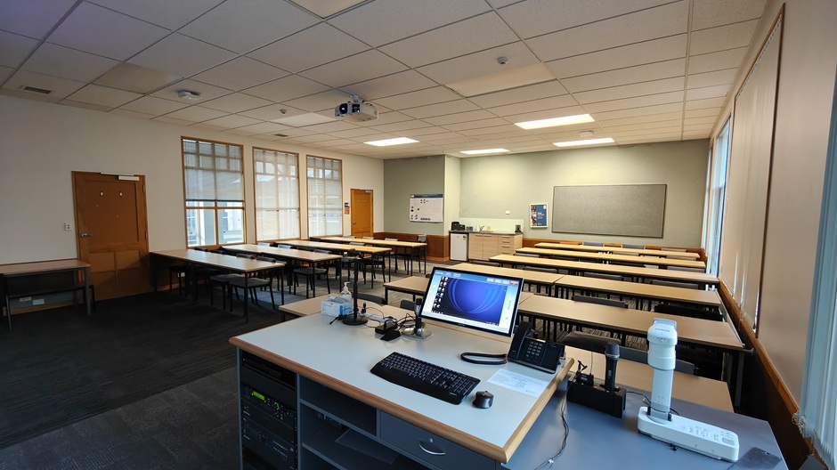A view of Ōwheo building seminar room G34, showing rows of tables and chairs