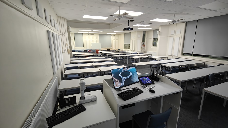 View of Surveying Building room G10 showing rows of tables and chairs