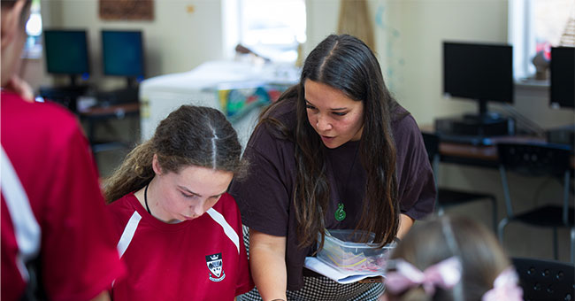 Sequoia Short, pictured here explaining her educational escape room game to Logan Park High School pupils, will present her project at the QS Reimagine Education Conference in London next year. 