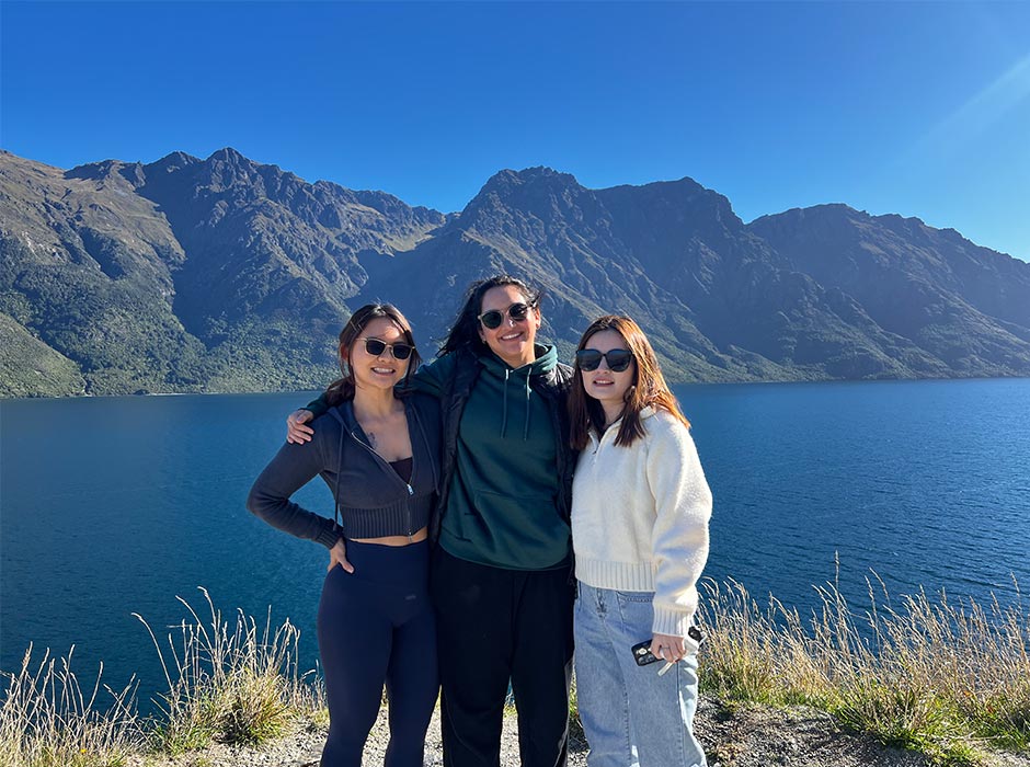 From left: Feng Chen, Gayathri Ponneri and Valentine Sheng enjoying nature by a lake.