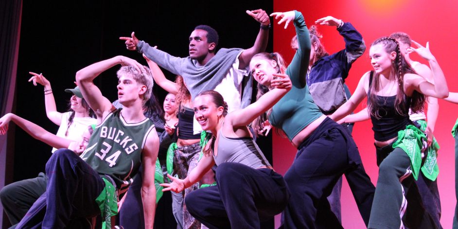 A group of students performing a dance routine.