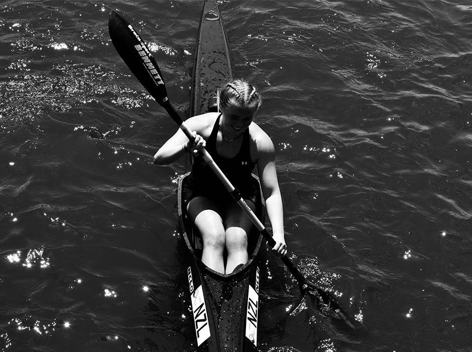 Hannah Webb pictured in a black and white photo kayaking.