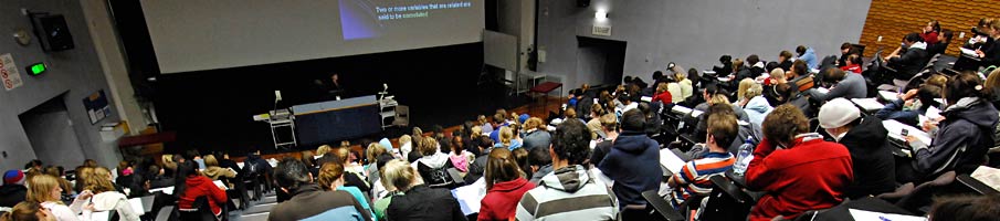 Students taking notes in a lecture