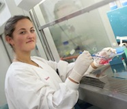 Photo of Georgia Bell working at a lab bench.