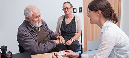 Pharmacist giving patient advice in clinic