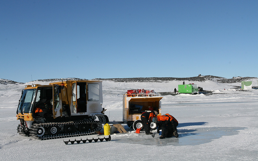 University of Otago staff working in Antarctic in front of snow mobile image 1x