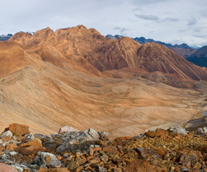 Red Mountain in South Westland. Foreground to distance: diorite, serpentine, peridotite, schist.