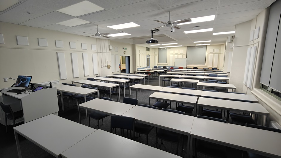 View of Surveying Building room G10 showing rows of tables and chairs