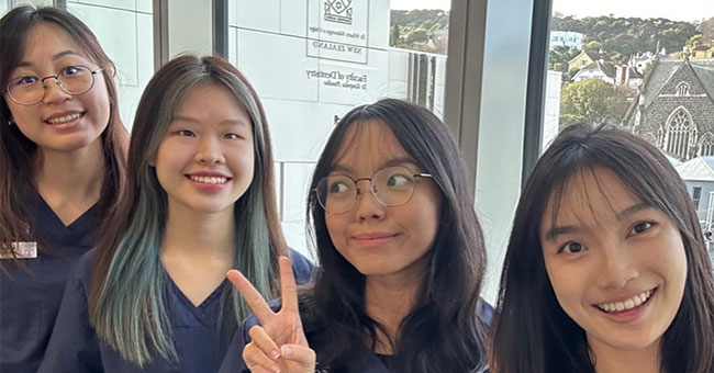 IMU students Reanne Heng, Xinyi Tan, Lee Yue Xin, and Racheal Chen at the Faculty of Dentistry. 