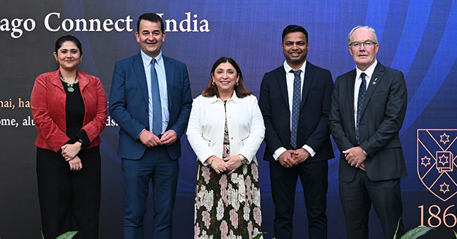 a row of people standing on a stage 
