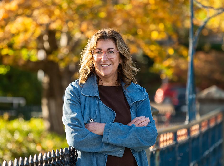 Dr Megan Pōtiki is pictured against an autumnal background. 