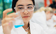 Student holding beaker in Chemistry lab