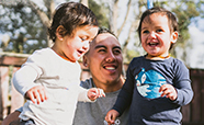 Father and two small children smiling thumbnail