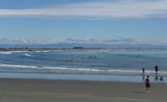Surfers waiting for a wave at Sumner (October 2017)<br />Photo: Anna Young