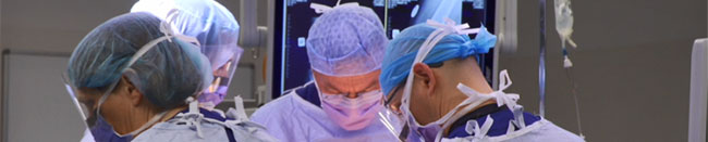 Close up of orthopaedic surgeon Gary Hooper at work in the operating theatre