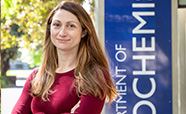 Sarah Diermeier standing outside in front of the Department of Chemistry sign thumbnail