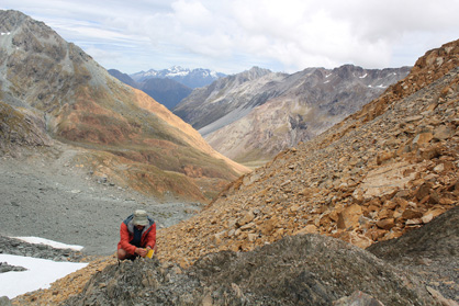 At Fiery Col in the Olivine Wilderness Area, field assistant Simon Alder collects structural data from the serpentinite mélange along the Livingstone Fault.