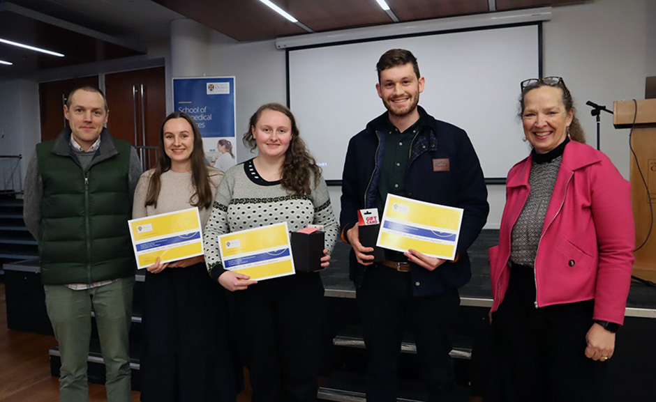 Three students: Stephanie Waller, Mary Hawkes, and Fergus Payne holding their certificates, with Peter Mace and Lisa Matisoo-Smith on either flank.