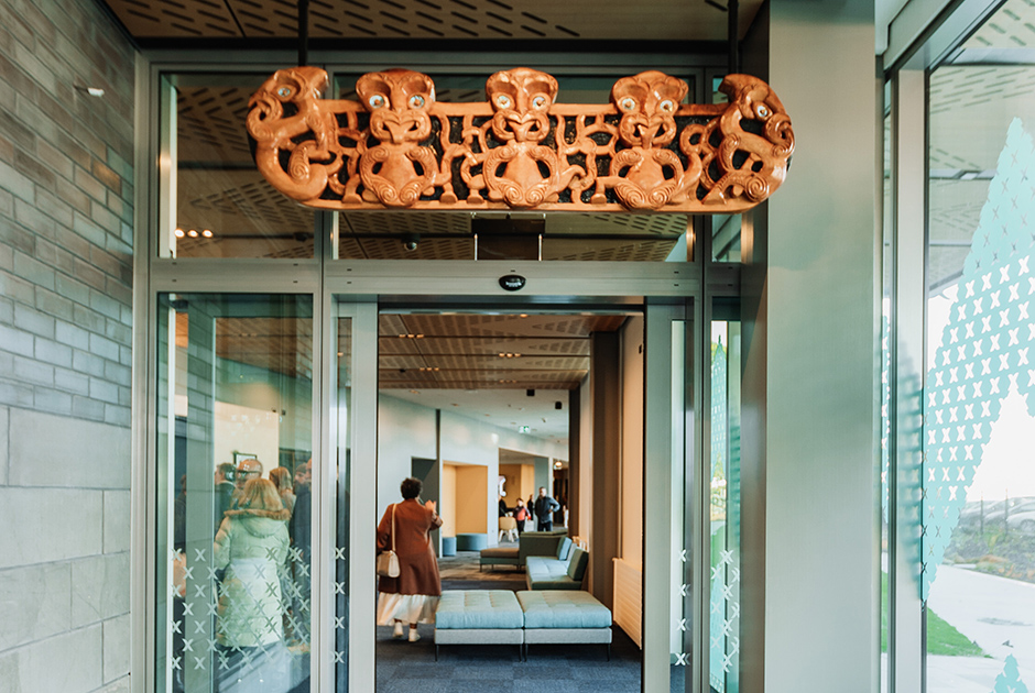View into Te Rangihïroa entrance lobby with Māori artwork above door.