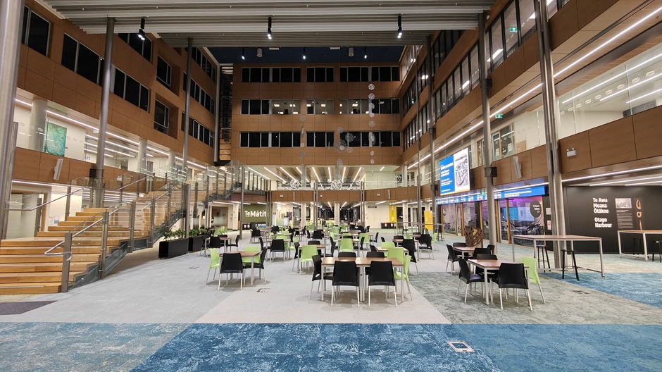 View of Otago Business School atrium, showing tables and chairs in groups