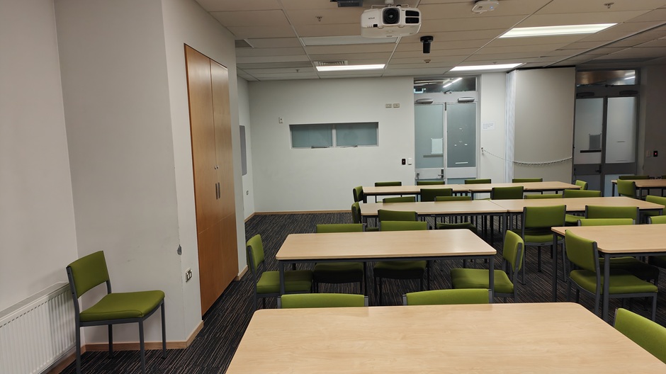 Setup of Hunter Centre rooms HUG30A-B showing movable tables and chairs and a movable dividing wall