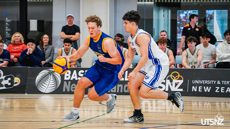 two men playing basketball 