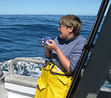 Abby Smith having a cup of tea on a boat out at sea image 1x