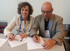 John Dean and Pamela Jeffries signing affilliation agreement between NZASH and SSIH