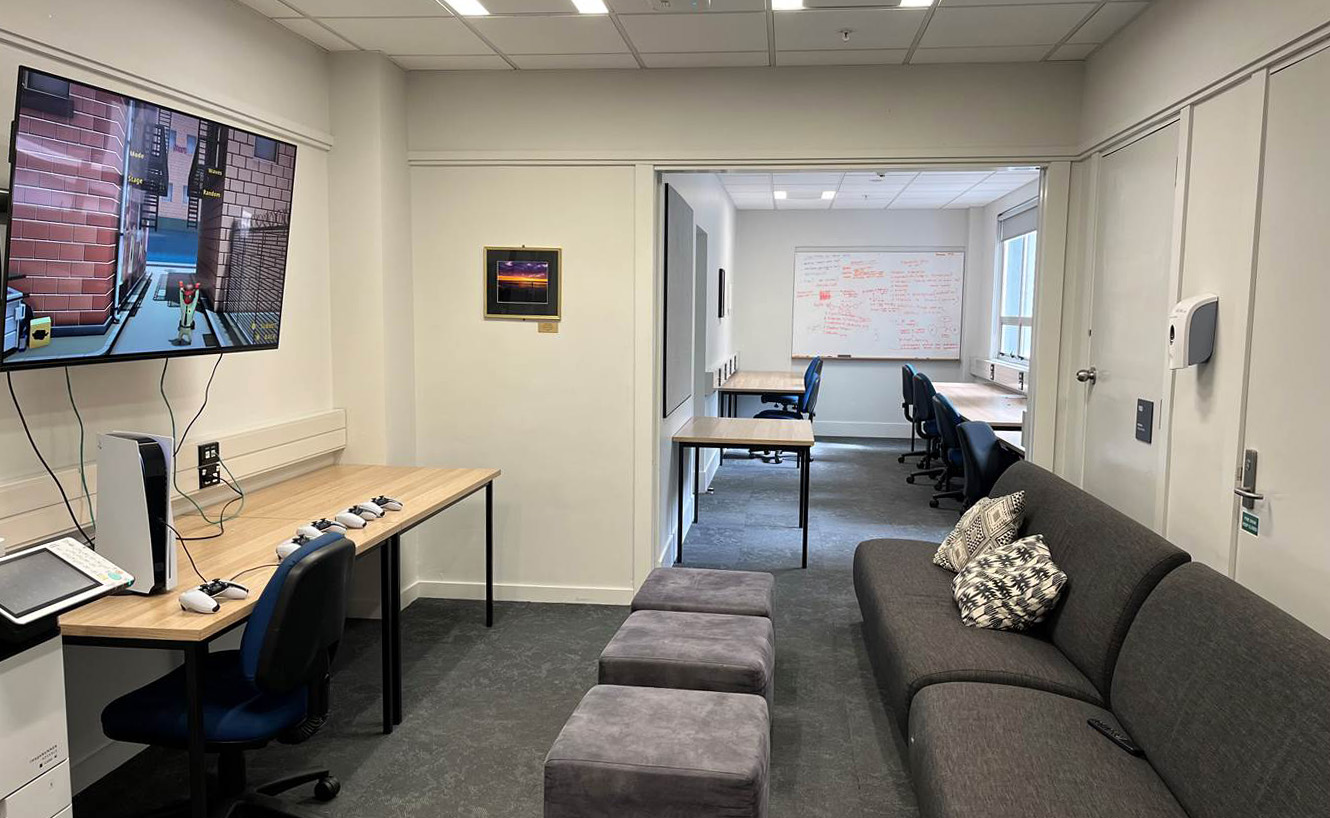 TV and computer room, with couches.