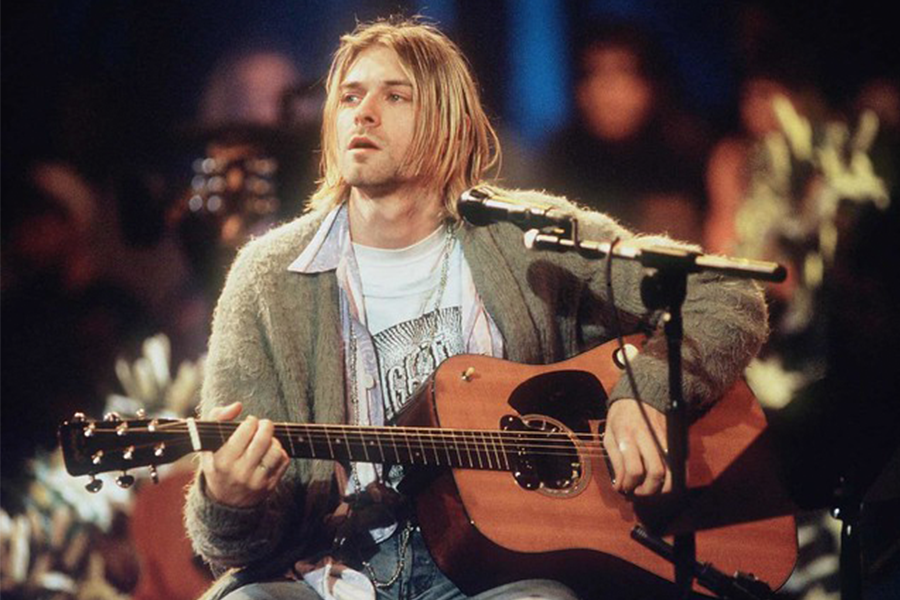 Kurt Cobain performs on stage