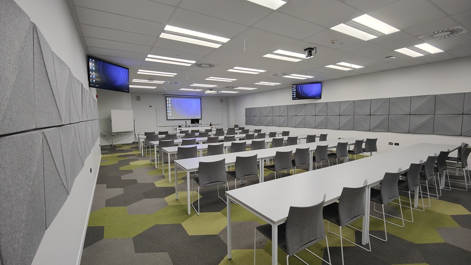 View of Mellor Laboratories room ME202, showing rows of tables and chairs