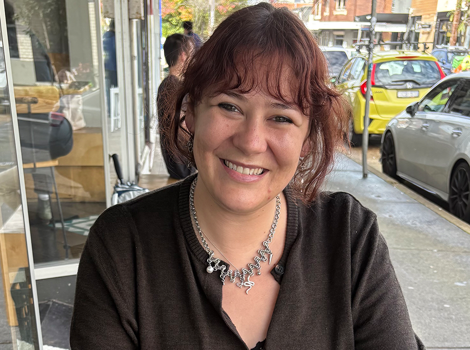 a woman sitting at a cafe 
