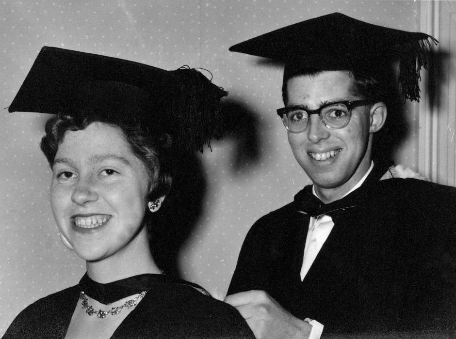 Two people in graduation attire 