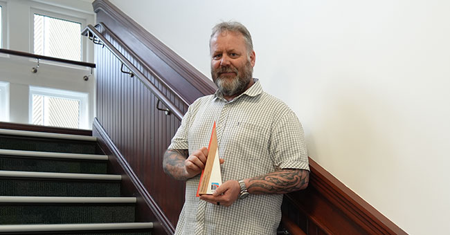 Shane-Jenkins-with-TEFMA-award trophy