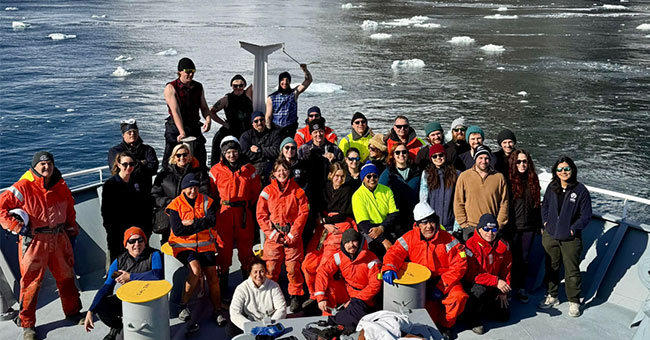 Group of people on a research vessel at sea