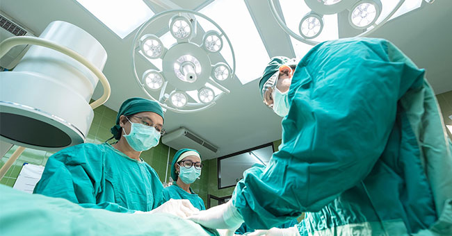 A generic image of surgeons in an operating theatre.