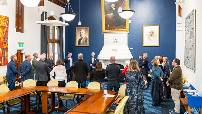 A crowd is pictured in Council Chambers.