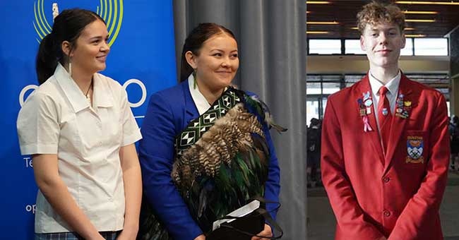 Two young women stand to one side, and young man stands opposite them