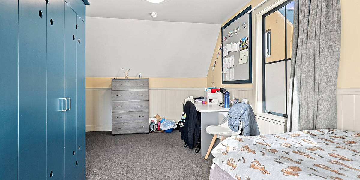 Student bedroom with wardrobe and desk