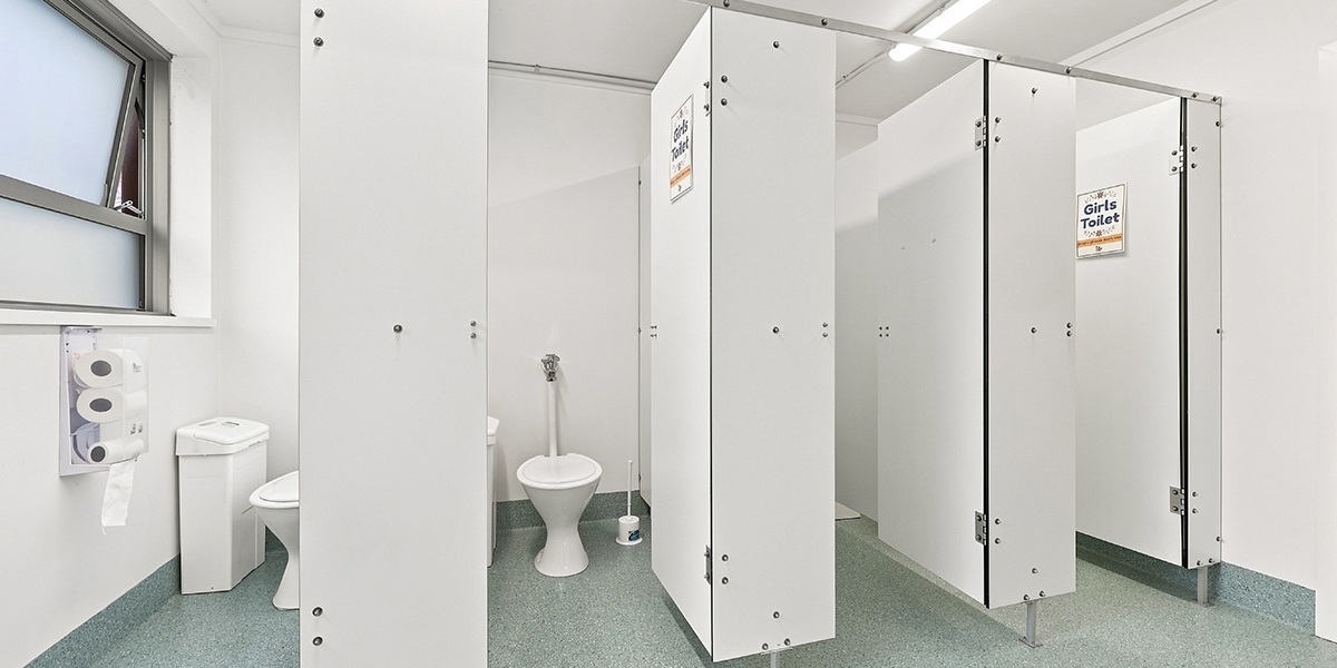 Shared bathroom facilities with toilet cubicles