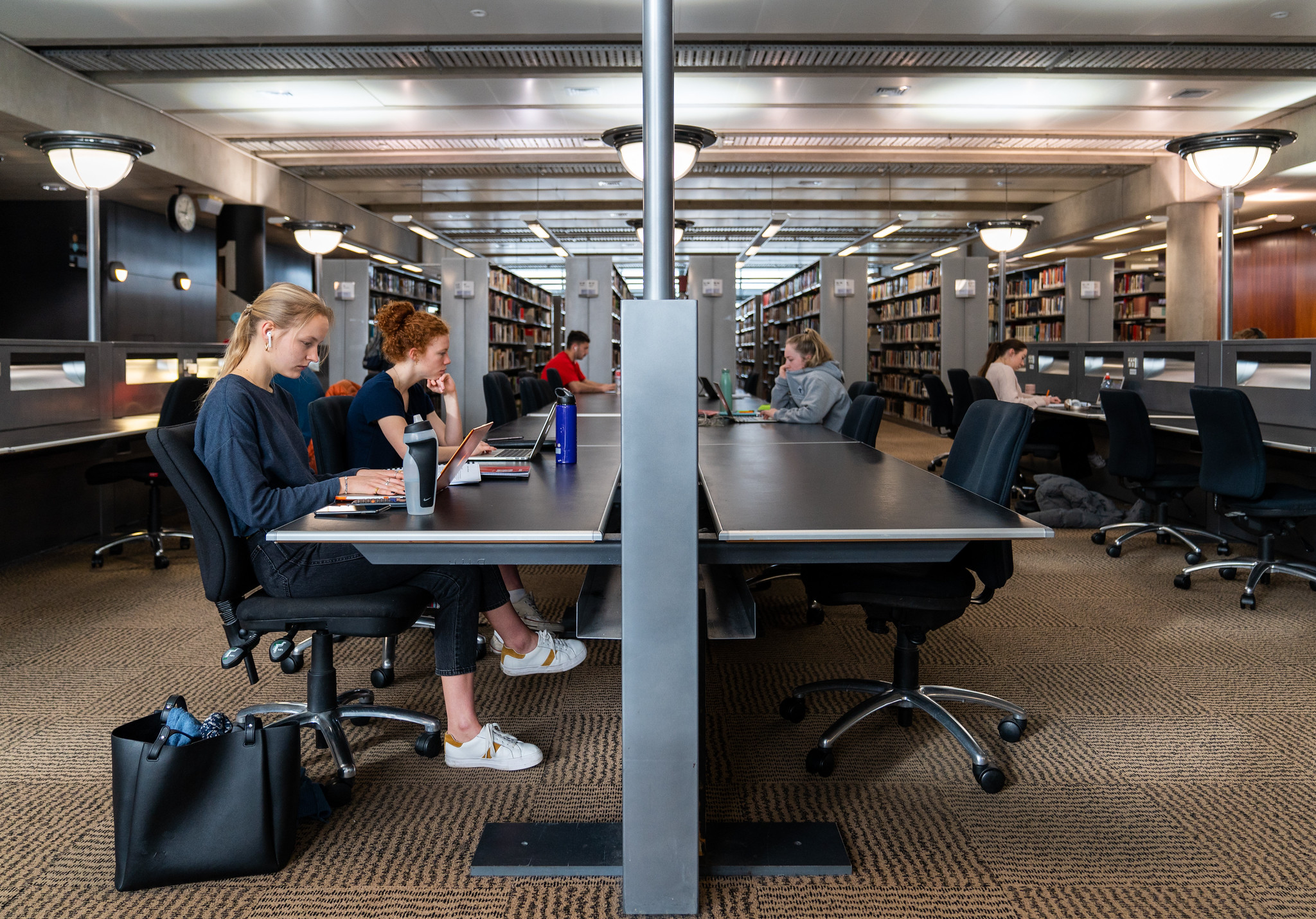 Students studying on the first floor of the library