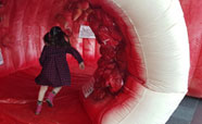 Child exploring a large inflatable bowel_thumbnail