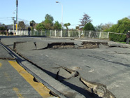 Cracked tarmac adjacent to a bridge in an area of Christchurch where ground shaking was probably amplified by local site soil effects.