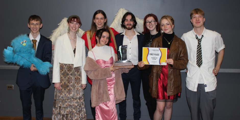 Student film crew receiving award.