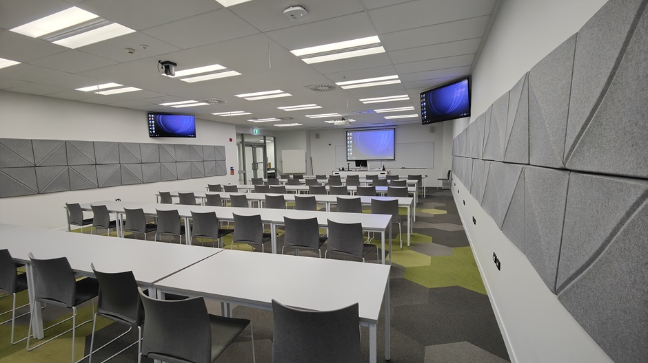 View of Mellor Laboratories room ME202, showing rows of tables and chairs