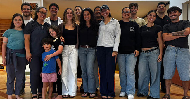 A group of staff, students and family members pose for a photo at Te Tumu. 