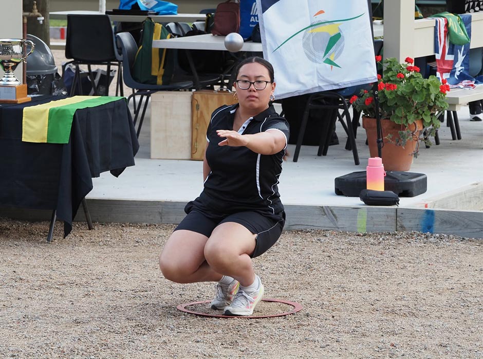 Akaina Tuiono in action playing pétanque.