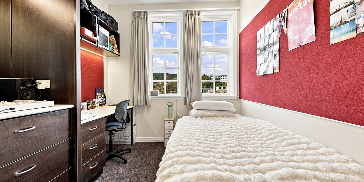Student bedroom, with bed, desk and shelving