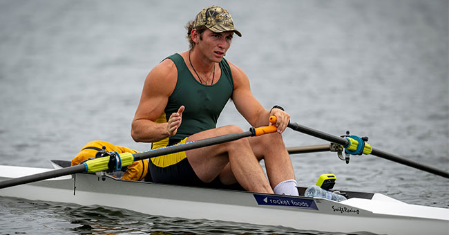 A man rows on the water.